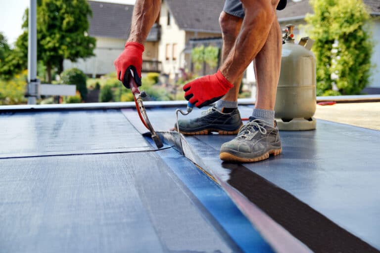 Man working on a flat roof